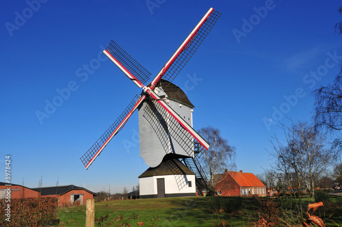 Windmill with blue sky background © Nicky Jacobs