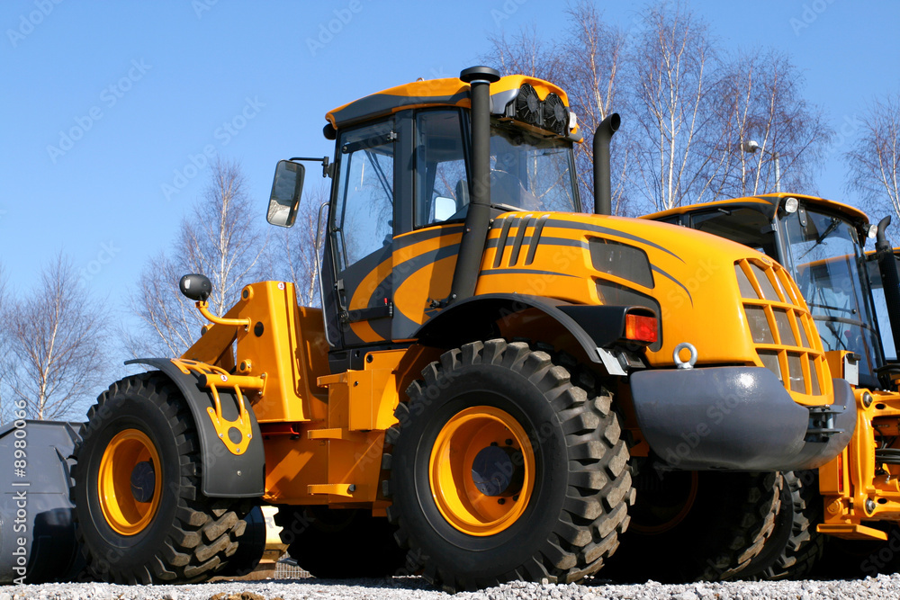 New, shiny and modern orange dozer machine.