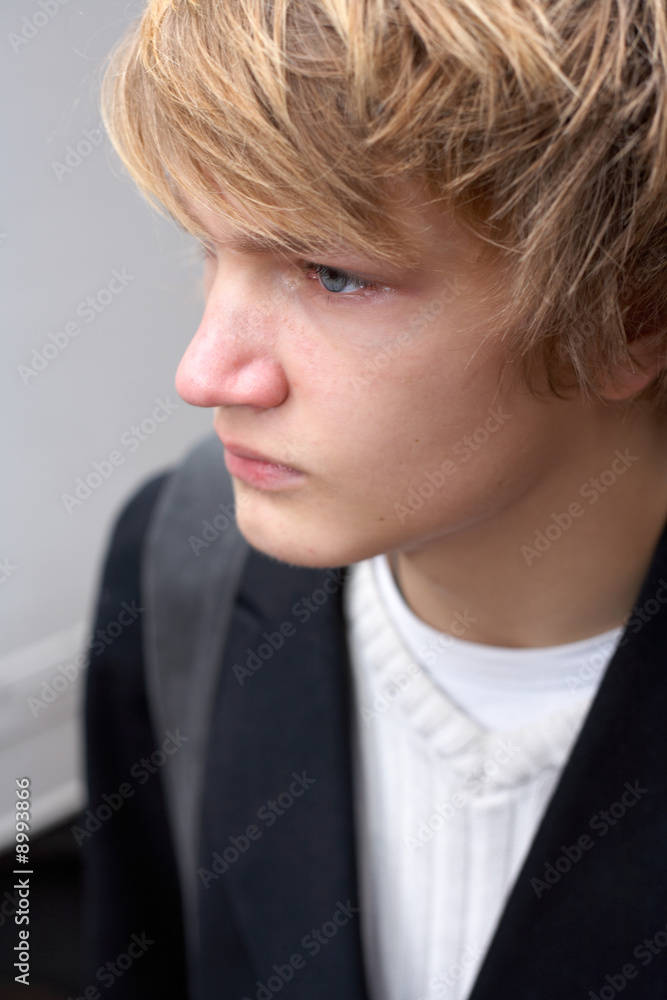 Portrait of teenage boy in street, high-angle close-up Portrait of teenage boy in street, high-angle close-up