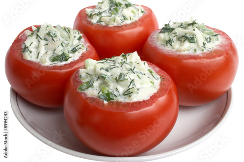 The red stuffed tomatoes in plate
