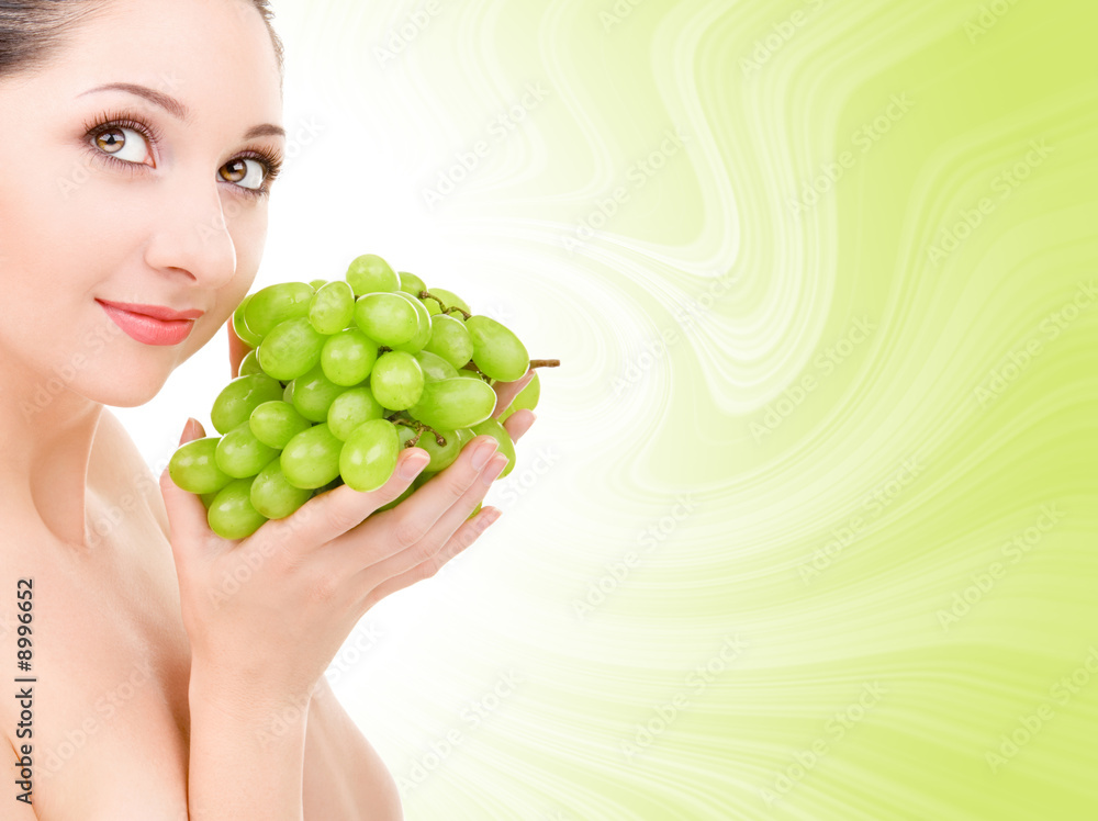 pretty woman with green grape isolated on the white background pretty woman with green grape isolated on the white background