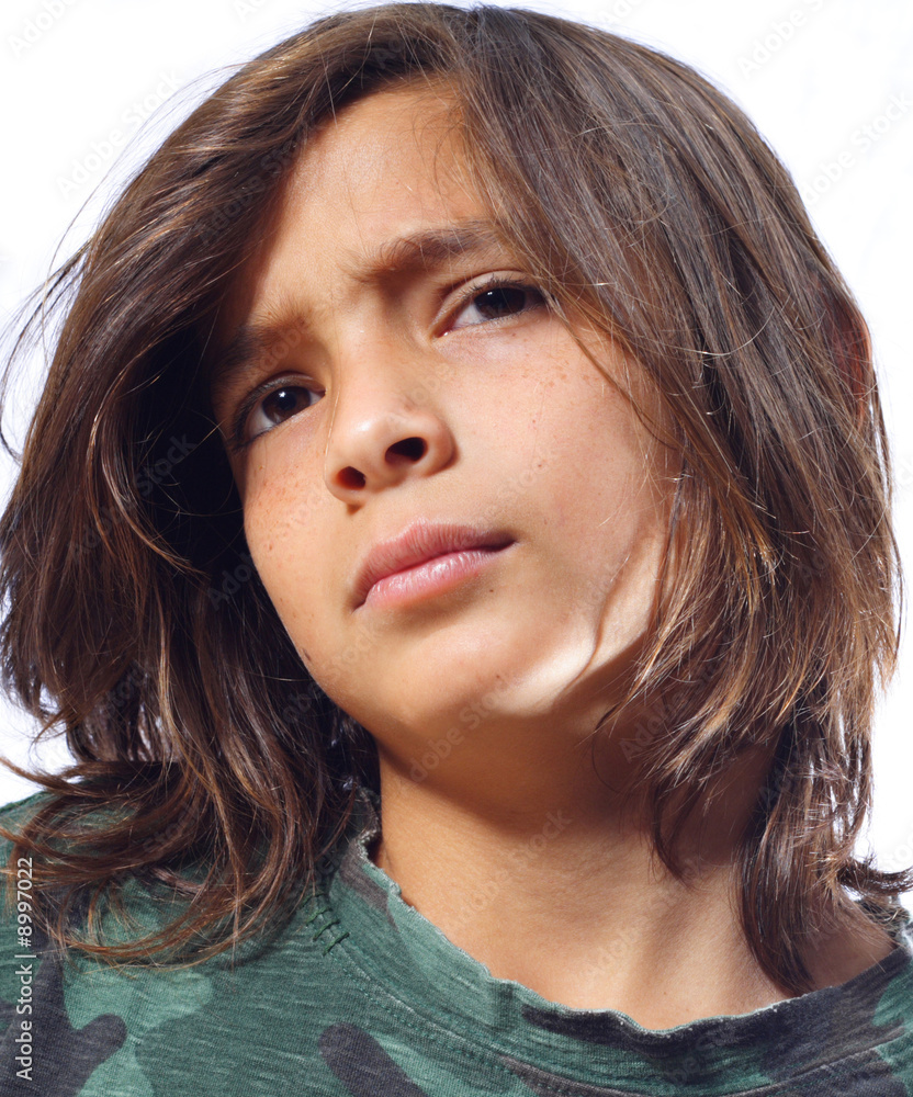 Headshot of a young boy with long hair Stock Photo | Adobe Stock