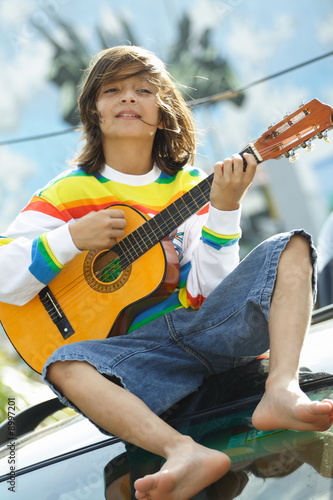 Boy with a guitar photo