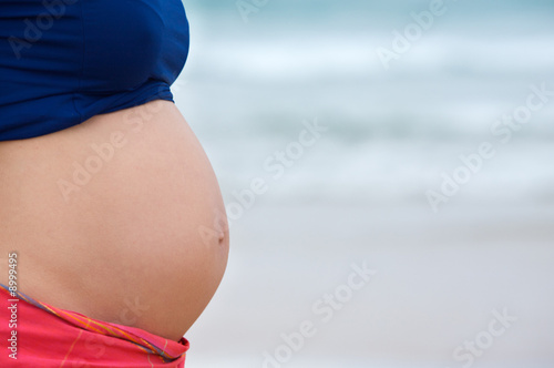 pregnant on the beach to the sea bottom