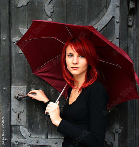 beautiful girl under red umbrella nier the old door photo