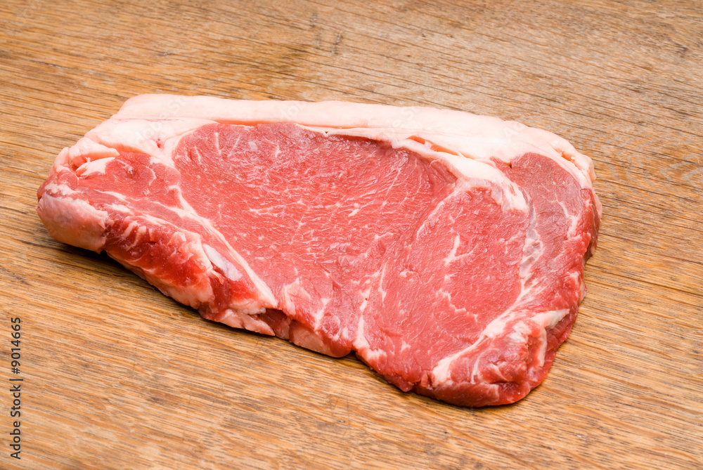 Red and Tasty Steak on a Wooden Table