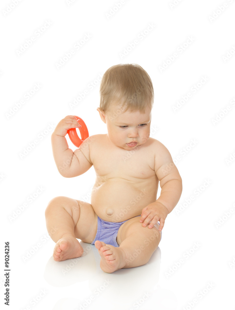 Small sitting baby with toy isolated on white Small sitting baby with toy isolated on white