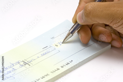 Hand signing a cheque