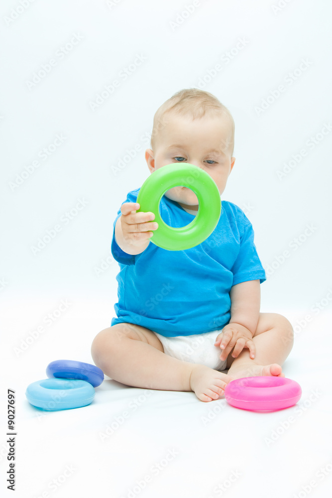 cute baby boy playing with colorful toys cute baby boy playing with colorful toys