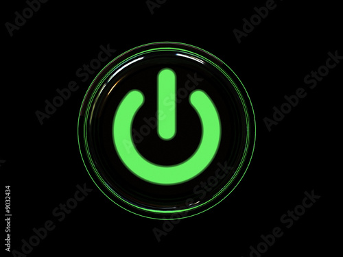 Green power button isolated on black background