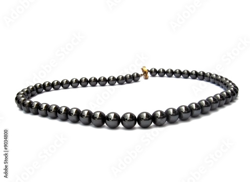 black pearl necklace on white background