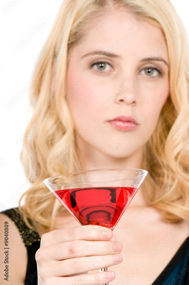 A pretty young woman holding a cocktail A pretty young woman holding a cocktail