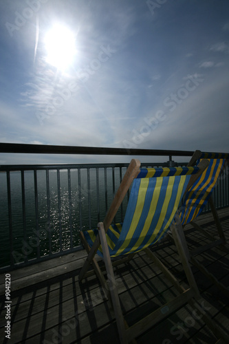 Striped Deckchair on English Seaside Pier photo