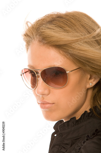 young woman in sunglasses on a white background