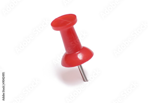Red thumb tack isolated on white background