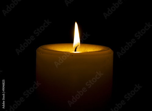 Candle on black background