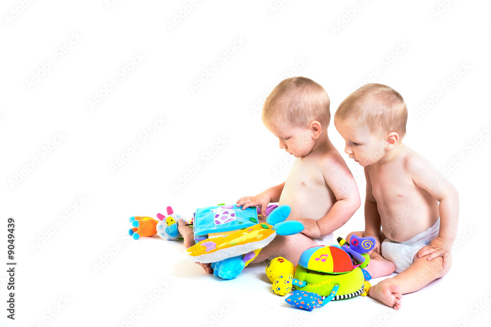 Twin baby boys are plaing together. Twin baby boys are plaing together.