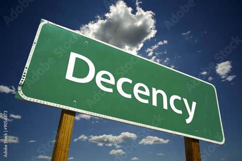 Decency Road Sign with dramatic clouds and sky.