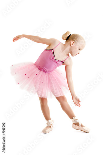 Young ballerina dancer over a white background
