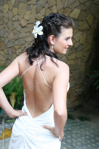 Beautiful young bride with flowers in her hair.