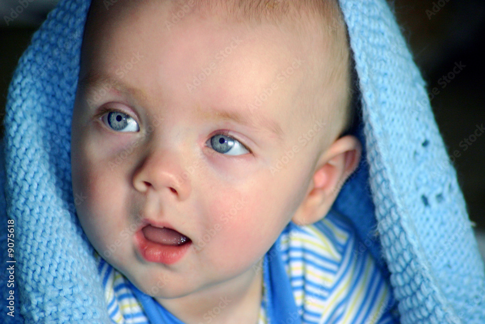 Cute Baby boy under a blue blanket Cute Baby boy under a blue blanket