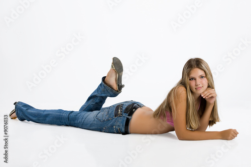 Teen age girl in a blue jeans and pink top