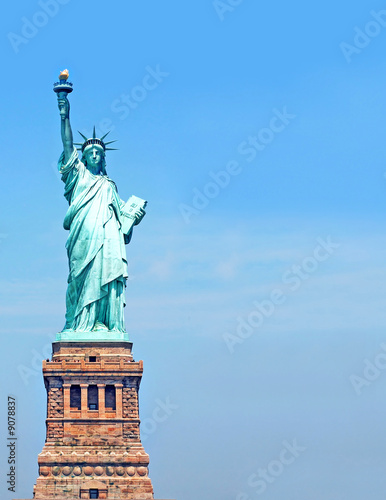 Statue of Liberty over blue sky