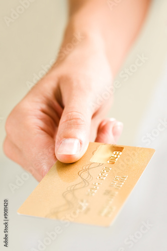 Close-up of female's hand holding credit card