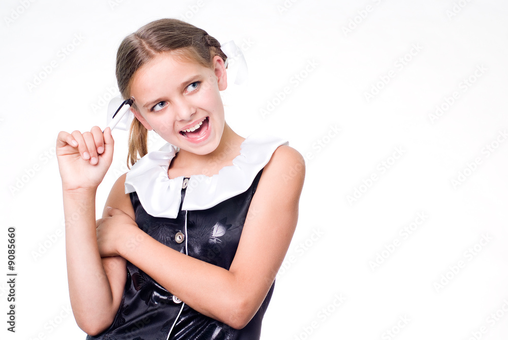 Funny pretty schoolgirl with pen scratching head