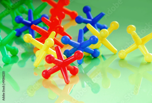 Array of colorful jacks child's toy photo