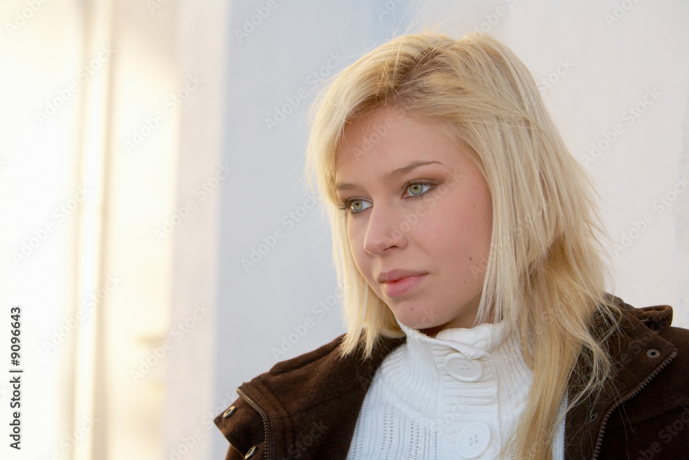 Teenage girl contemplating outdoors, looking away Teenage girl contemplating outdoors, looking away