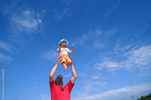 Little baby girl and sky