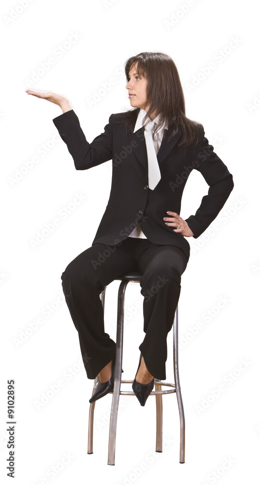 Fototapeta premium Young businesswoman sitting on a high chair