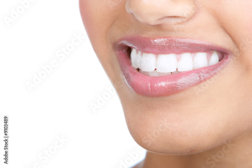 Beautiful young woman teeth. Isolated over white background.