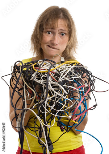 crazy woman with tangle of cables and wires in hands