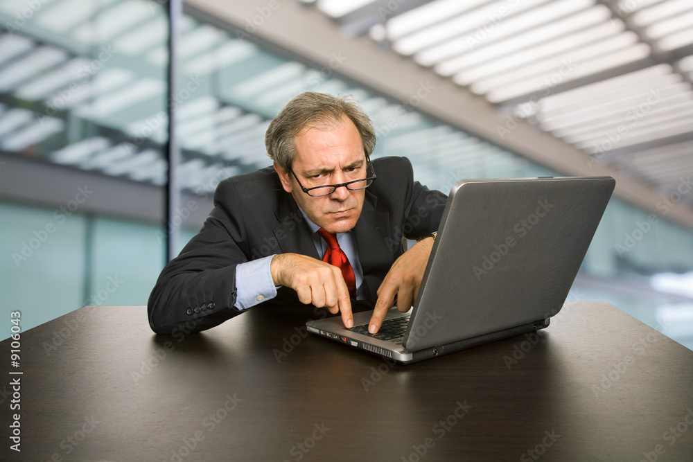 mature business man working with his laptop mature business man working with his laptop