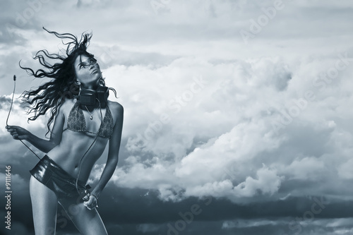 Music in the air. Woman with headphohes and cord