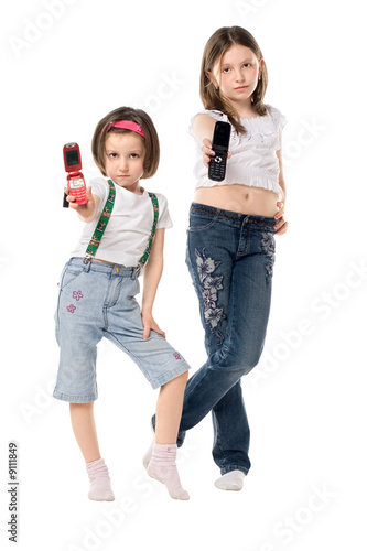 Two little girls with mobile phones
