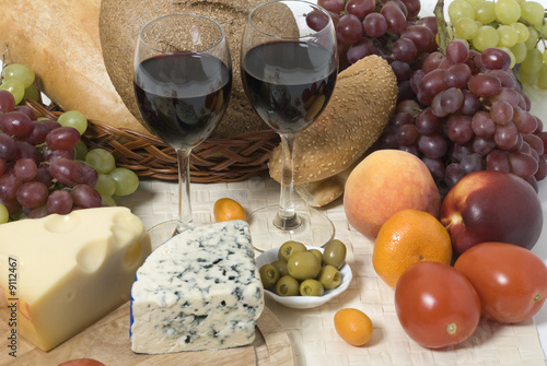 Wine, bread, cheese, fruit and vegetables