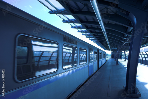 Blue train at subway hall platform