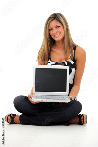 Happy young woman holding a...