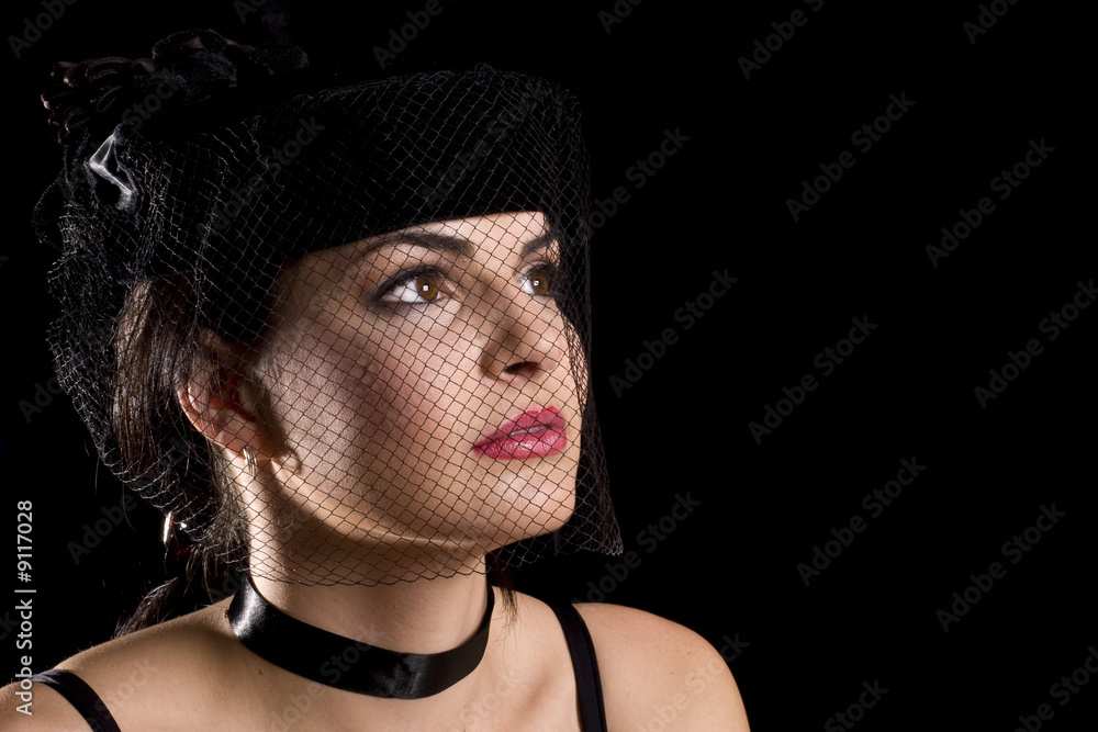 Attractive brunette woman wearing net hat looking to the right Attractive brunette woman wearing net hat looking to the right