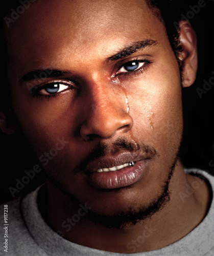 Fotografering Beautiful Image of a young Black man crying