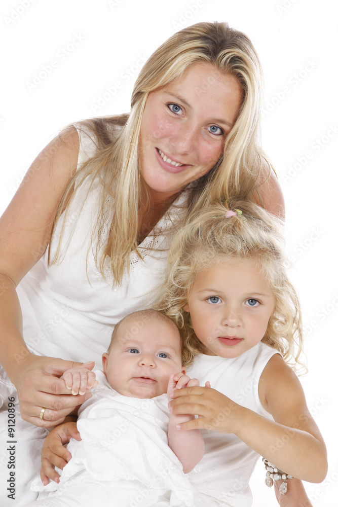 mother with her two daughters all dressed in white mother with her two daughters all dressed in white