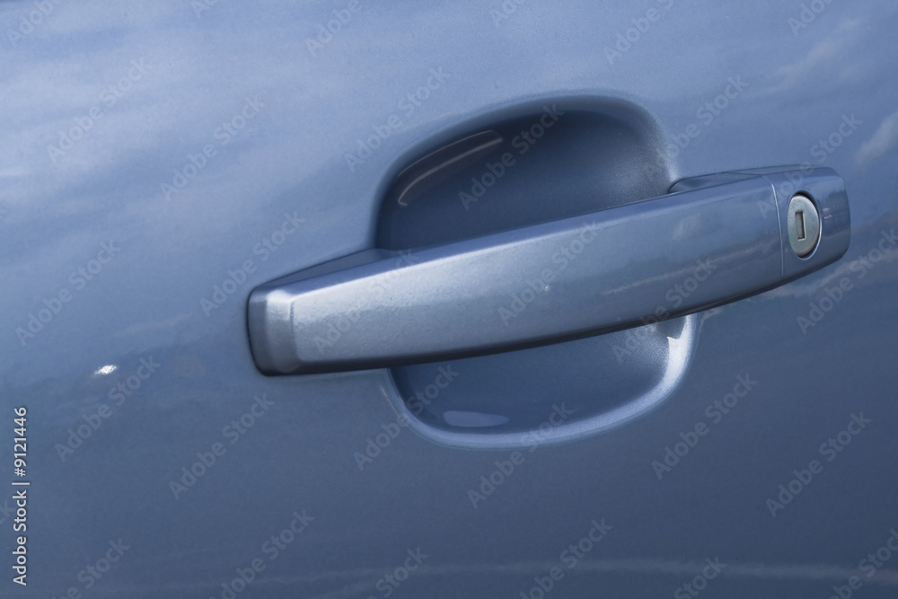 Car handle with a lock in a close up Car handle with a lock in a close up