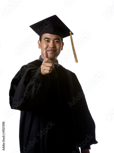 Model in graduation robes pointing his index finger
