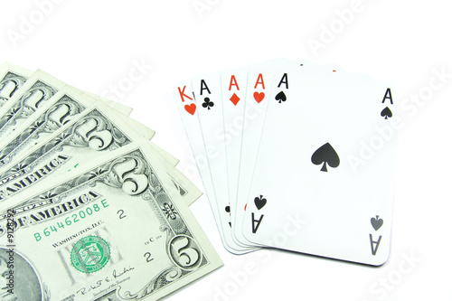 Dollar banknotes with face value 5 and holdem poker cards