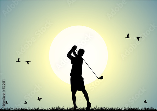 Man playing golf at sunset in a meadow