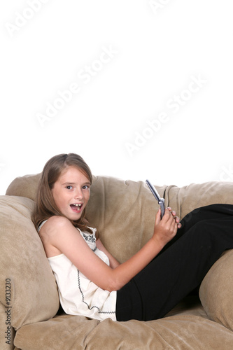 girl with cell phone on chair