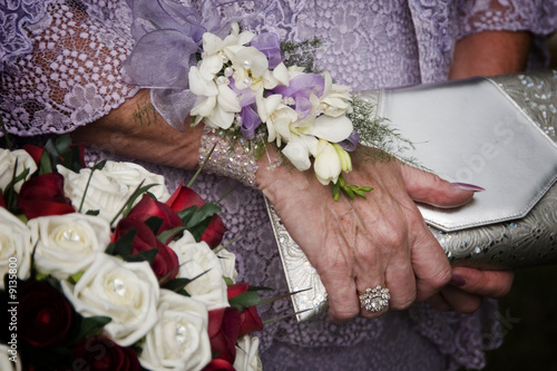 Flowers, hands and handbags